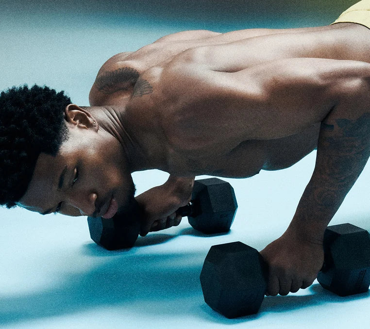 An athlete training with dumbbells