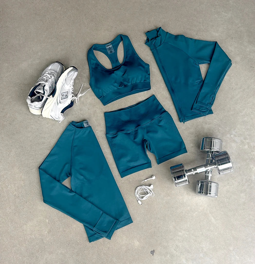 Teal ECHT activewear with trainers and workout accessories